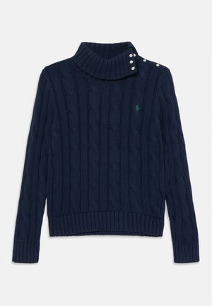 Suéter de punto marinero en color navy con cuello alto, con embellishments de botones en el hombro y dobladillos y puños acanalados. Detalle del logo en verde.