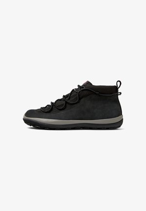 Black high-top sneaker featuring a textured upper, curved sole, and decorative laces, displayed from the side on a white background.