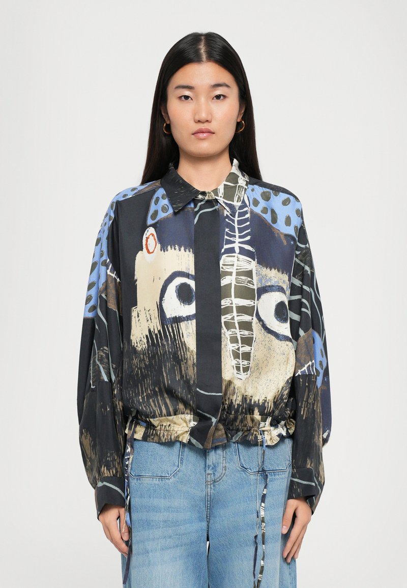 Long-sleeve button-up shirt featuring abstract patterns in blue, black, and beige, with a drawstring hem and a classic collar.