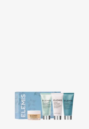 Quatre produits de soin de la peau Elemis Pro-Collagen, comprenant un baume nettoyant et trois nettoyants pour le visage, disposés devant une boîte bleue fleurie.