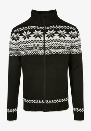 Sort zip-sweater med høj krave, prydet med hvide snefnug- og geometriske mønstre på den øverste del, samt ribbede manchetter og kant.