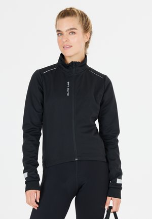 Black zip-up jacket with a high collar. Features reflective strips on shoulders and cuffs, made of smooth, stretchable fabric.