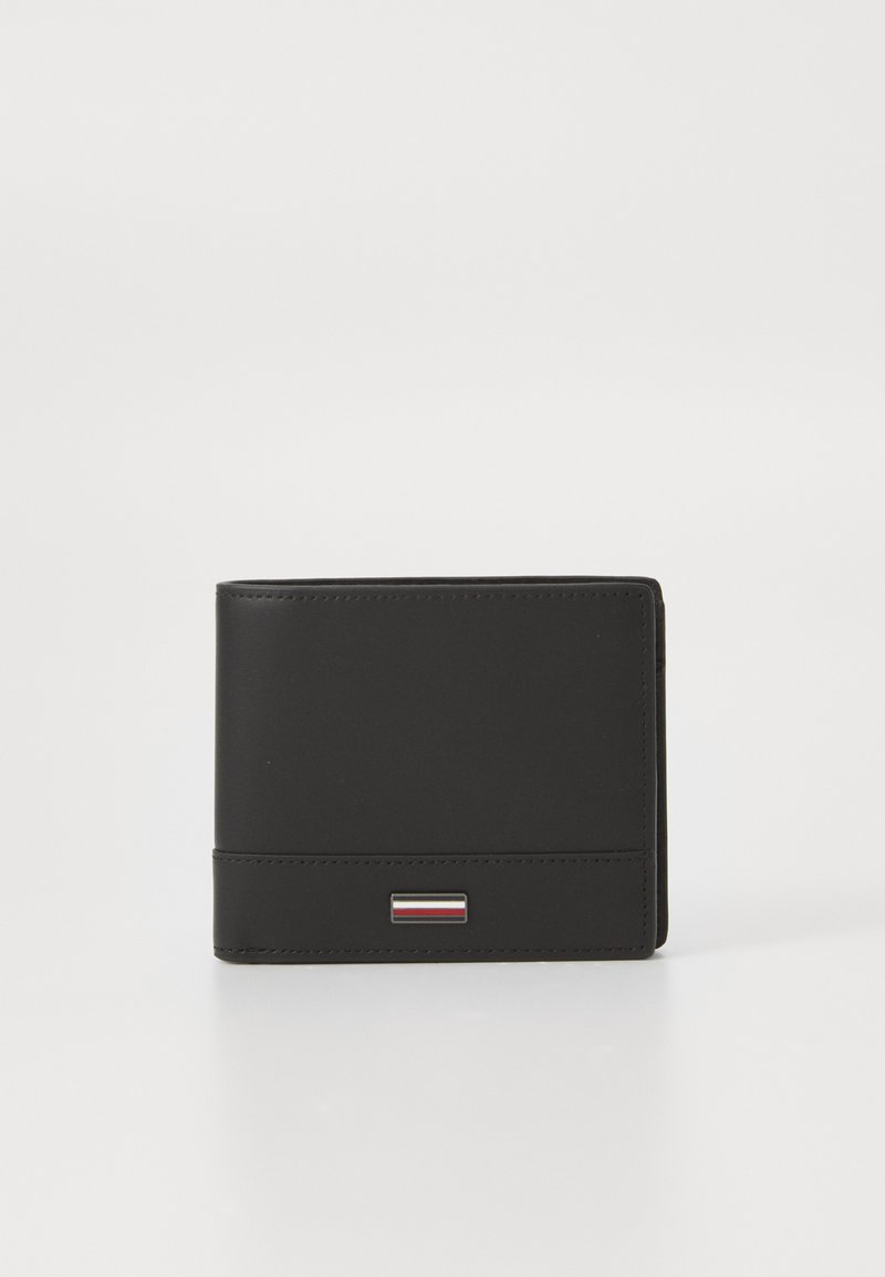 Black leather wallet with a rectangular shape, featuring a small silver and colored accent on the front and stitched detailing.