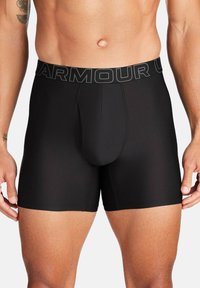 Schwarze, figurbetonte Boxershorts aus einem glatten, dehnbaren Material mit einem elastischen Bund mit Markenlogo und einem konturierten Frontbeutel.