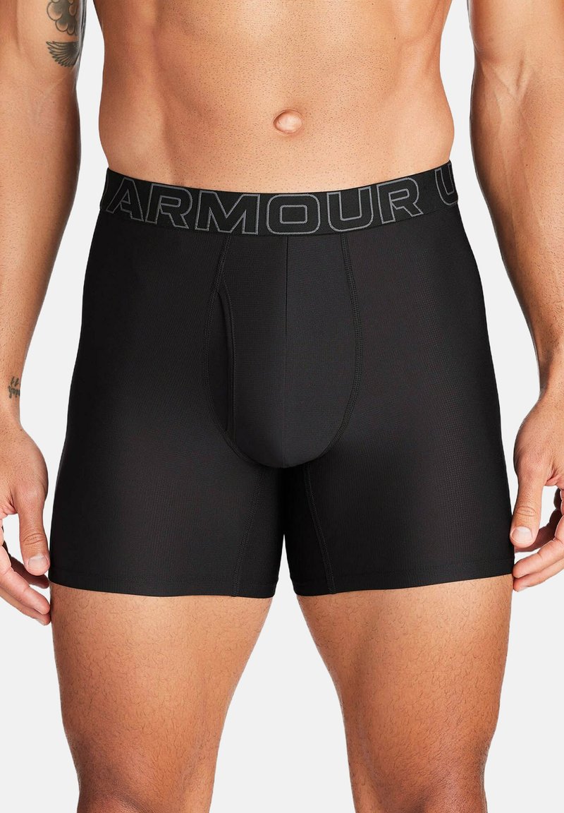Schwarze, figurbetonte Boxershorts aus einem glatten, dehnbaren Material mit einem elastischen Bund mit Markenlogo und einem konturierten Frontbeutel.