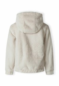 Kremkrāsas mākslīgās kažokādas jaka ar kapuci, elastīgiem piedurkņu galiem un apakšmalu. Mīksta tekstūra, ko izceļ gluda, plush virsma un bezšuvju dizains.