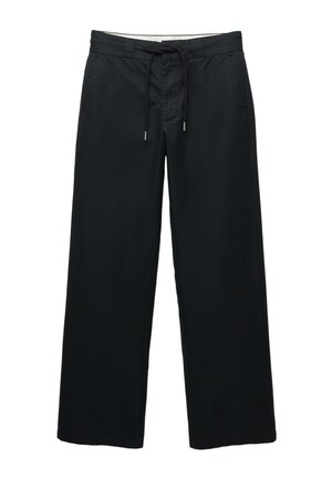 Pantalons larges noirs en mélange de coton doux. Dotés d'une taille élastique à cordon de serrage et de poches latérales. Texture lisse et détails minimalistes.
