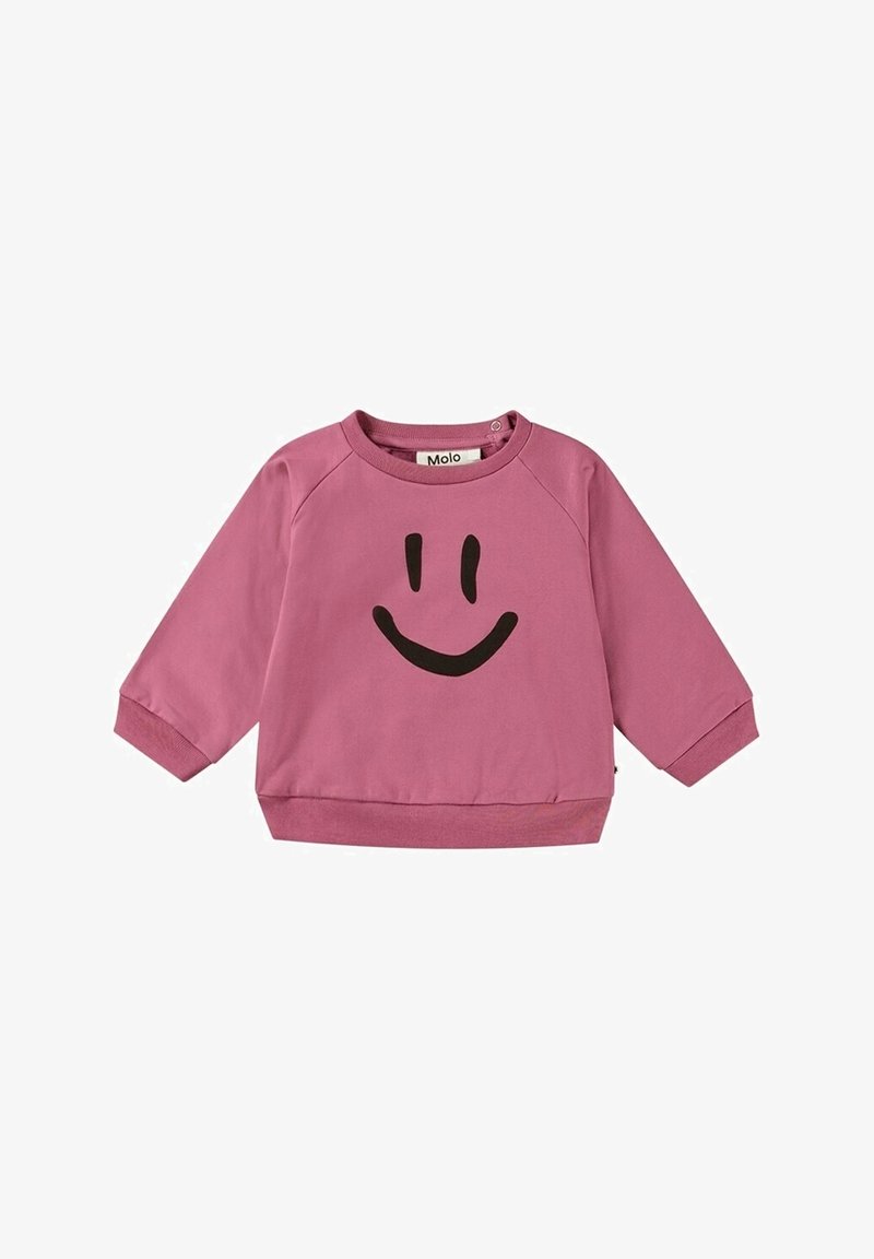 Sweat-shirt rose à manches longues pour tout-petit avec un motif de visage souriant noir sur le devant et des boutons-pression à l'épaule.