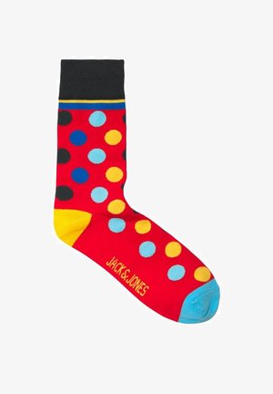 Calze rosse con grandi pois multicolori in blu, giallo e nero. Cuffia nera con strisce blu e gialle; punta blu e logo.