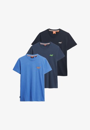 Three cotton T-shirts stacked: one light blue, one navy, one dark navy. Each features a small embroidered logo on the chest.