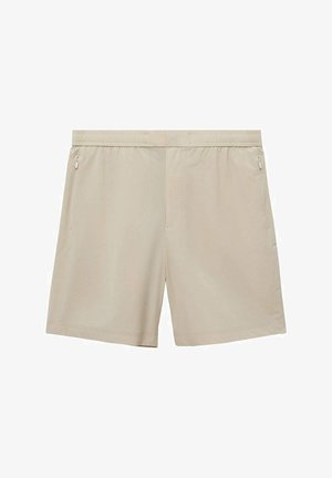 Beige shorts valmistettu kevyestä materiaalista, jossa on joustava vyötärönauha ja kaksi sivutaskua vetoketjulla turvalliseen säilytykseen.