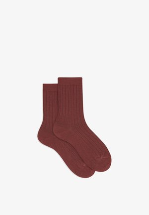 Brown ribbed cotton socks with a solid design, featuring a mid-calf length and elasticated tops. Soft texture and uniform color.