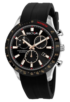 Black chronograph watch with a rubber strap, silver accents, a black face, and tachymeter scale. Features three sub-dials and date display.