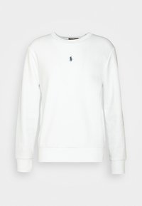 Biała bluza z długim rękawem i okrągłym dekoltem, z małym granatowym logo gracza polo na środku klatki piersiowej, ściągacze na mankietach i u dołu.