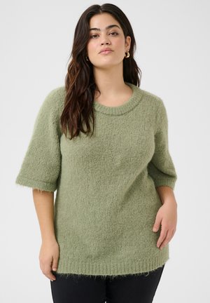Green, fluffy sweater with a round neckline and short sleeves. Features a loose fit and slightly frayed hem at the bottom.