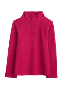 Top fucsia a maniche lunghe con colletto alto e pattina con quattro bottoni. Tessuto morbido e testurizzato; vestibilità ampia con spacchi laterali all'orlo.