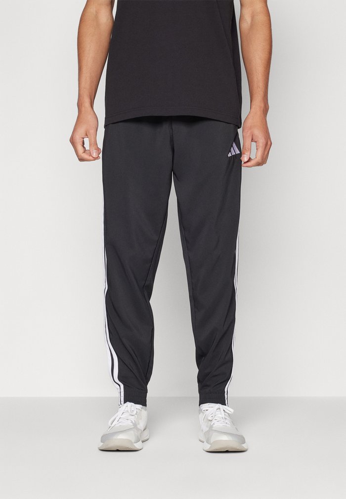 adidas ESSENTIAL THREE STRIPES - Tracksuit bottoms - black/white
