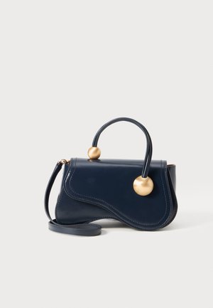 Navy blue leather handbag with a curved design, gold accent spheres, and a top handle. Includes a detachable shoulder strap.