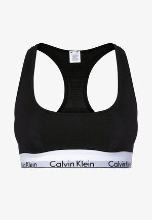 Schwarzes Sport-BH aus glattem Stoff, mit Racerback-Design und einem weißen Bündchen am unteren Ende, auf dem das Logo "Calvin Klein" gedruckt ist.