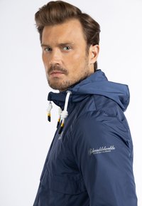 Schmuddelwedda Waterproof jacket - marine