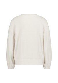Rundhals-Pullover in hellbeige, mit langen Ärmeln, einer lockeren Passform und einem weichen, strukturierten Stoff. Keine sichtbaren Verschlüsse.