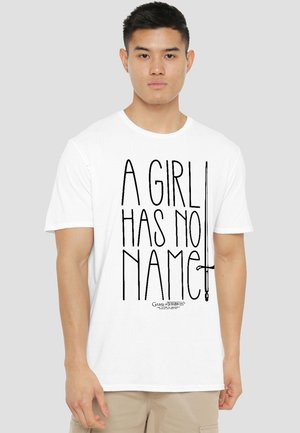 Young man wearing a white T-shirt with "A GIRL HAS NO NAME" text and a sword graphic from Game of Thrones.