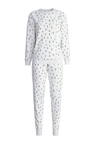 Witte pyjama-set met lange mouwen en broek, met kleurrijke winterthema patronen van skiërs, bomen en sneeuwmannen. Zachte stof en ribgebreide manchetten.