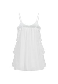 Robe blanche sans manches à volants superposés avec bretelles spaghetti, coupe ample et trois volants en couches de chaque côté, présentée sur un fond uni.