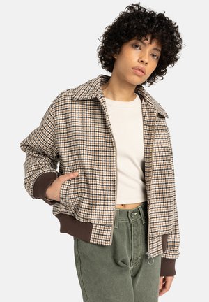 Brown and cream houndstooth patterned bomber jacket with a large collar and ribbed cuffs, featuring a front zipper and side pockets.