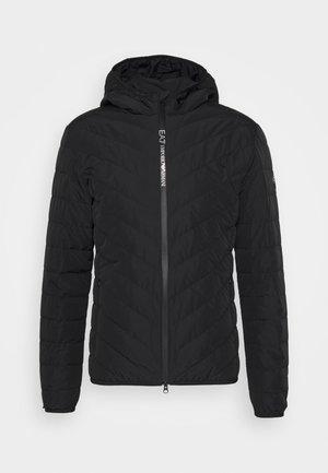 Black puffer jacket with a quilted chevron pattern, featuring a hood, front zipper, and branded label on the chest. Smooth texture.