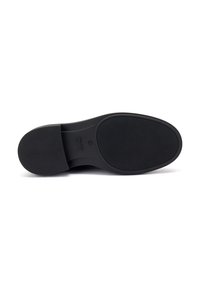 Suola nera della scarpa con una superficie texture, caratterizzata da una forma arrotondata e un tacco piatto. Il materiale sembra resistente e flessibile.