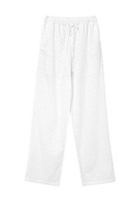 Pantalons en coton blanc à coupe décontractée, avec des détails en œillets, une taille élastique et un cordon de serrage. Design à jambes droites.