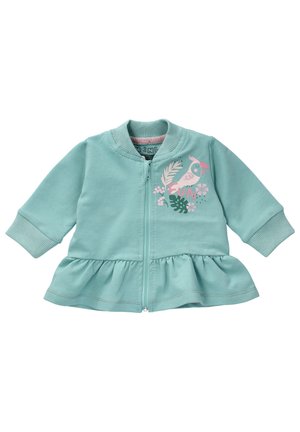 Himmelblaues Zip-Jackett mit gesmoktem Peplum-Saum. Mit einem Druck von Vögeln und Blattwerk in Pink und Grün auf der linken Brust. Weicher Stoff, lange Ärmel.