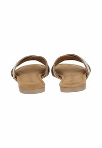 Flat sandals with a tan faux suede footbed, two adjustable straps, one featuring silver glitter accents, open-toe design.