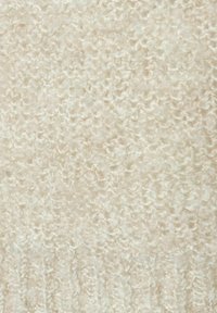 Lichtbeige gebreide stof met een zachte, pluizige textuur, met een losse, lussenpatroon en subtiele kleurvariaties.