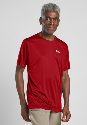 Rood sportshirt met korte mouwen, gemaakt van gladde, vochtregulerende stof. Voorzien van een ronde hals en een klein logo op de linkerborst.