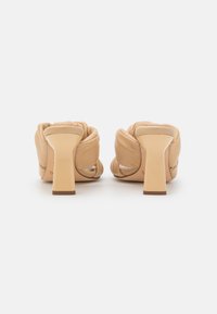 Unisa SABAS - Mules de salto - butter