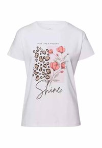 Biała bawełniana koszulka z nadrukiem w panterkę z jednej strony, różowym kwiatowym wzorem z drugiej, oraz napisem "Wstań jak feniks" i "Błyszcz."