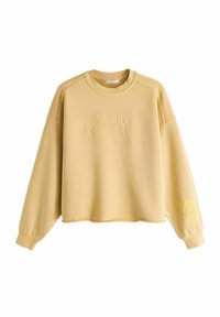 Sudadera de cuello redondo color beige con "MALIBU CALIFORNIA" bordado en el pecho y la manga, con mangas largas y puños acanalados.