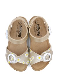 Sandales beiges avec un motif floral comprenant des marguerites blanches, une bride de cheville réglable et des accents de boucle blanche sur une semelle texturée. Taille 24.