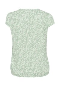 Top verde chiaro con una texture morbida e un motivo floreale sparso in bianco. Maniche a cappuccio e scollatura rotonda.