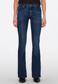Dark blue flared jeans made of denim with a smooth texture. Features five pockets, a button closure, and belt loops.