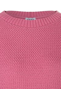 Pink knitted sweater with a textured pattern, round neckline, and ribbed trim. Fabric appears soft and cozy, showcasing a uniform hue.