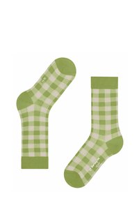 Zielono-kremowe skarpetki w kratkę o miękkiej fakturze, wzmocnionym palcu i pięcie oraz jednolitym zielonym mankiecie. Nazwa marki widoczna na podeszwie.