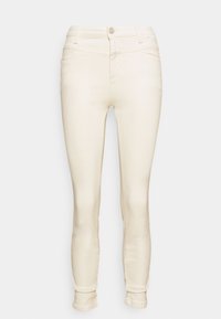 Crèmewitte skinny jeans met een zachte textuur, vijf zakken, een ritssluiting aan de voorkant en riemlussen. Tapere pijpen en minimale stiksels.