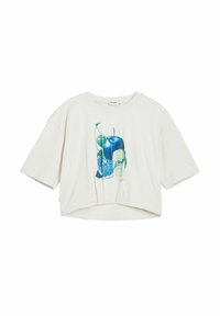 T-shirt cropped de couleur crème en coton, présentant un design graphique de fruits colorés dans des nuances de bleu et de vert. Manches courtes.