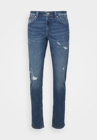 Mörkblå denimjeans med rak passform, försedda med slitna lappar och en klassisk fem-fickdesign. Utrustade med knäppning.