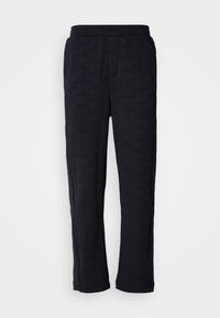 Pantaloni blu navy con motivo geometrico testurizzato, vita elastica, gambe dritte e senza hardware o accenti visibili.