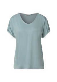 Haut bleu clair à manches courtes avec un décolleté en cœur et des détails froncés sur les manches. Tissu lisse et doux avec une coupe décontractée.
