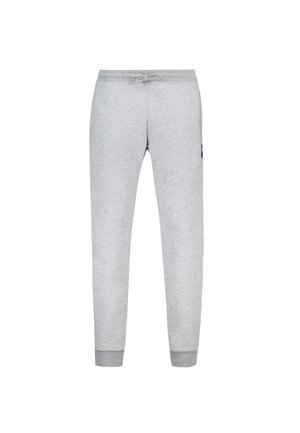 Pantalones de chándal grises de algodón con cintura elástica y cordón, piernas ajustadas y puños de canalé. Presenta un pequeño logotipo en un costado.